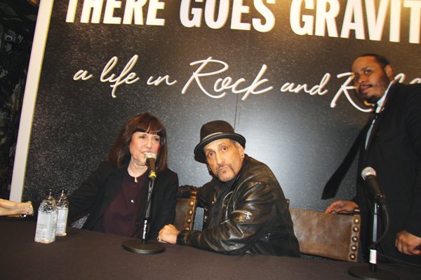 Handsome Dick Manitoba joined Lisa Robinson at the Varvatos store at 315 Bowery, the former location of CBGB, to introduce rock journalist Robinson’s new book, “There Goes Gravity: A Life in Rock and Roll.” Manitoba and his band, the Dictators, were regulars at CBGB. Nowadays, his bar, Manitoba’s, on Avenue B, is part of Alphabet City’s biggest industry, the “food-services and drinking places” sector.   Photo by Clayton Patterson