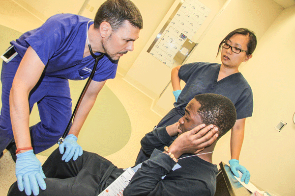A doctor assessed a Queens student playacting having lost his hearing in an explosion.
