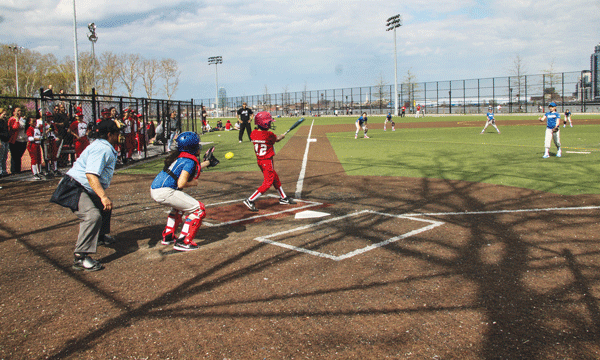 G.V.L.L.’s pitcher blazed a fastball past a Furies batter. In the end, though, the hot-hitting East Side team’s bats couldn’t be silenced.  Photos by Tequila Minsky