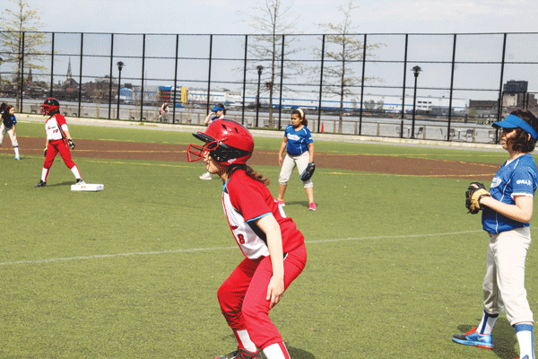 Furies runners on base look in to home plate.