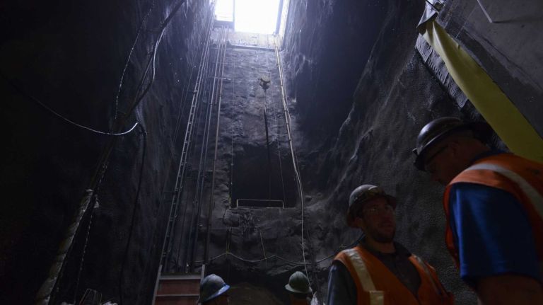 Workers in the 86th Street cavern wait for material to be lowered into the future 86th Street station of the Second Avenue Subway line on Thursday, May 01, 2014. 