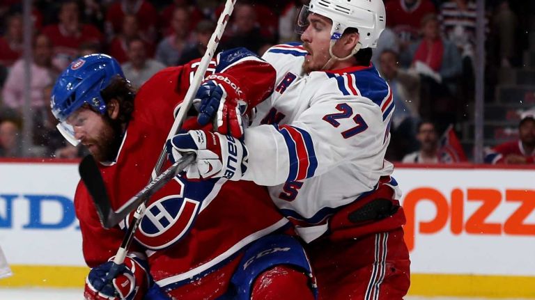 Ryan McDonagh checks David Desharnais during the first period on May 19, 2014.
