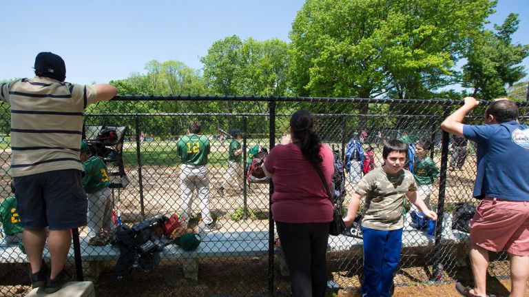 Parents and friends watch a Little League baseball game at Crocheron Park in North Bayside on Saturday, May 17, 2014.