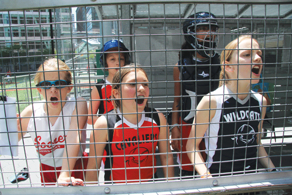 The Downtown All-Stars — here cheering on a teammate at bat — definitely came to play.   Photos by Tequila Minsky