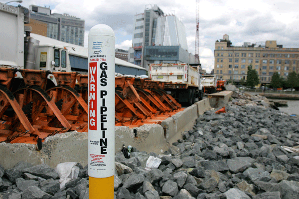 A marker shows the Manhattan entry point of the Spectra pipeline under the Gansevoort Peninsula, with the new Whitney Museum in the background. Photo by Sam Spokony