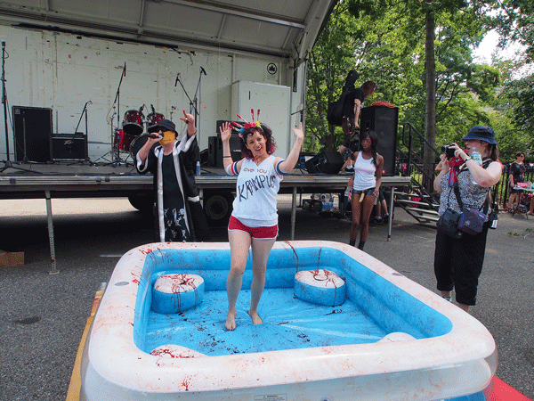 GLOB wrestling in Tompkins Square Park (Our Lady of Perpetual PMS, in the “Love You Krampus” T-shirt).    Photo by Dan Perico