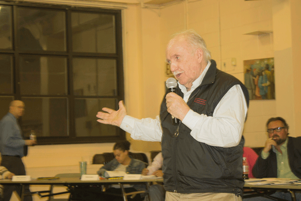 Ed Sullivan, representing Letitia James, talks about the Public Advocate’s current efforts to make school lunches available for all students and acquire funding for additional police officers. Photo by Zach Williams.