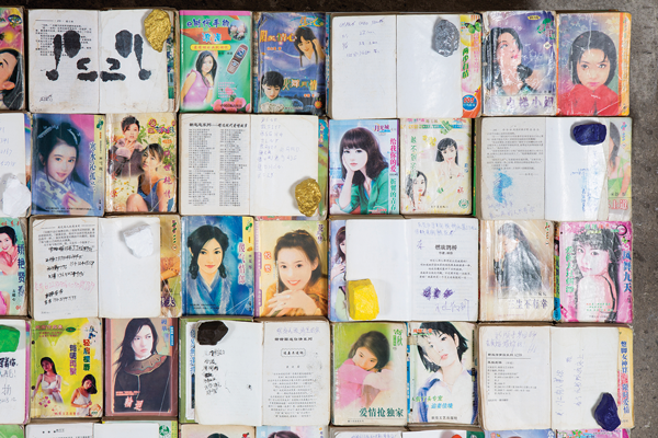 Anonymous notes found among pulp fiction novels give voice to the migrant workers of Shenzen, in Liu Chang’s “Love Story.” At Salon 94 Freemans, through June 21.  Courtesy of the artist and Salon 94, New York