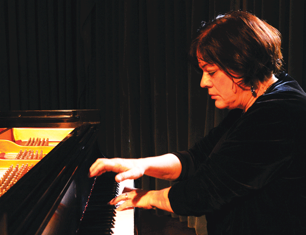 The West Village Chorale dedicates their spring concert to pianist and assistant conductor Elena Belli’s distinguished 25-year run.   Photo by Steven Sutton