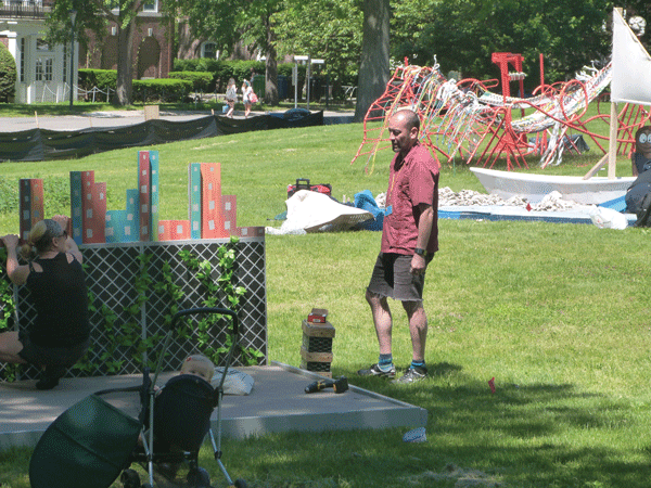 Downtown Express photo by Josh Rogers Artists and very young assistant were putting the finishing touches Sunday on the artistic mini golf course that opens Sat., June 7 on Governors Island (govisland.nyc.gov) as part of the Figment art fest. The golf and popular TreeHouse will be open all summer.