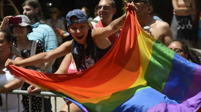 Spectators celebrate during the New York City pride parade in Manhattan on Sunday, June 29, 2014.