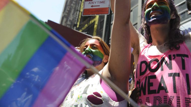 Spectators celebrate during the New York City pride parade in Manhattan on Sunday, June 29, 2014.