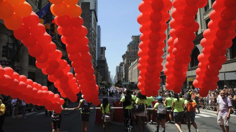 Participants walk during the New York City pride parade in Manhattan on Sunday, June 29, 2014.