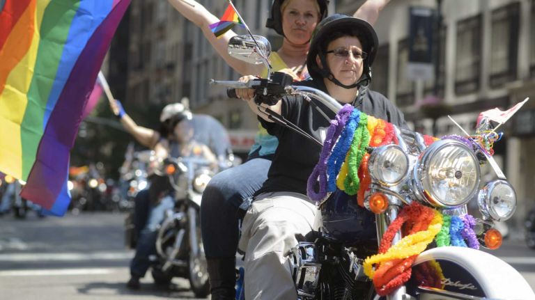 Members of the Sirens women's motorcycle club ride toward the start of the New York City gay pride parade on Sunday, June 29, 2014, in Manhattan. The parade this year marks 45 years since the raid on the Stonewall Inn, and the riots that followed, starting the American gay-rights movement.