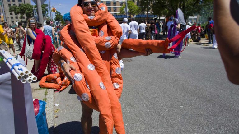 A man in costume prepares for the start of the annual Coney Island Mermaid Parade on Saturday, June 21, 2014.
