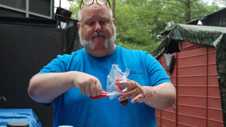 Prop master Jay Duckworth shows off a prepared 