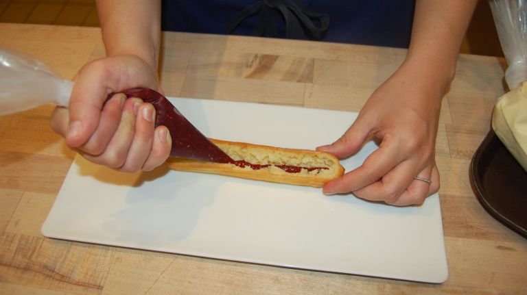 Éclair recipe from Bouchon Bakery 30 Take your pastry bag of raspberry jam and pipe a thin layer into the bottom of the éclair. (Note: Bouchon makes its own raspberry jam, but any quality store-bought jam is fine.)