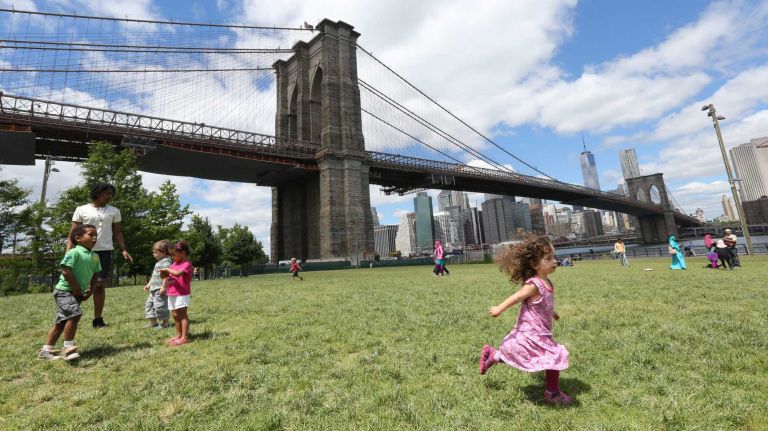 Children play in Brooklyn Bridge Park in Dumbo on Friday, June 6, 2014. 