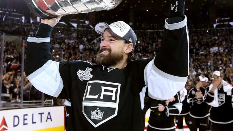 Justin Williams of the Los Angeles Kings celebrates with the Stanley Cup after the Kings 3-2 double overtime victory against the New York Rangers in Game Five of the 2014 Stanley Cup Final at Staples Center on June 13, 2014 in Los Angeles.