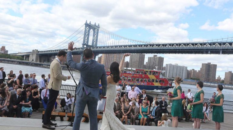 A wedding takes place in front of Jane's Carousel in Brooklyn Bridge Park in Dumbo on June 6, 2014.