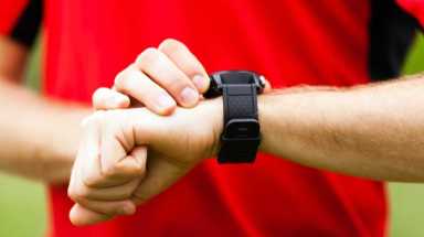 Runner looking at sport watch