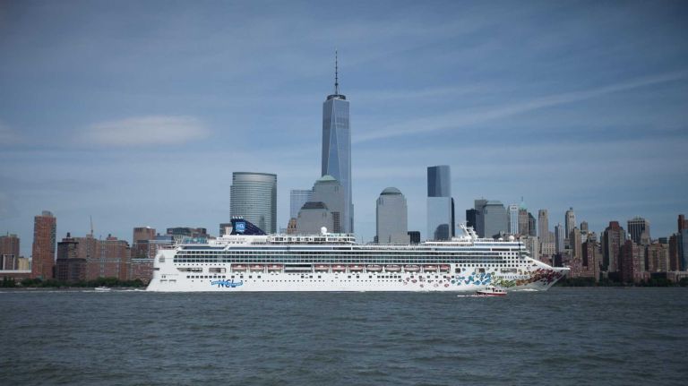 The Norwegian Gem, a ship from Norwegian Cruise Line chugs down the Hudson past the West Side of Manhattan on June 21, 2014.  