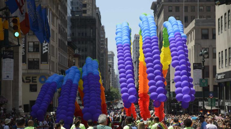 Participants walk during the New York City Pride Parade in Manhattan on Sunday, June 29, 2014.