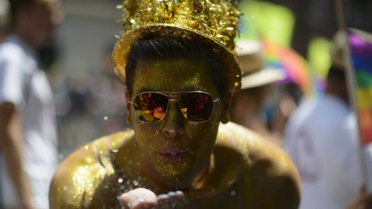 Participants walk during the New York City pride parade in Manhattan on Sunday, June 29, 2014.