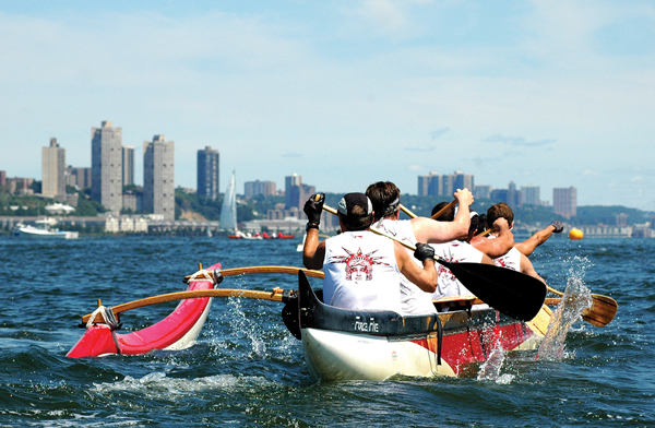 New York Outrigger members paddling up the Hudson River. Club members often go for paddles of up to 15 miles.  Photo by Eric Ratkowski