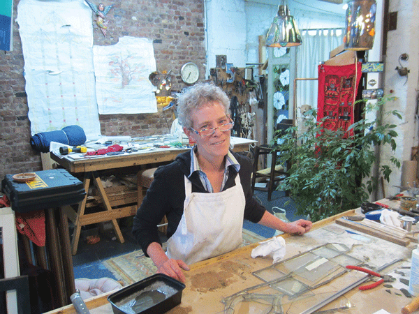 Sandy, looming rent put stained-glass artist on the edge 1 Patti Kelly in her E. Eighth St. studio. Photo by HEATHER DUBIN