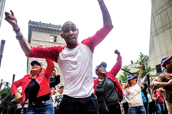 Guardian Life employees dancing June 11 at a “Flash Event” to bring attention to the Police Museum.  Downtown Express photo by Zach Williams