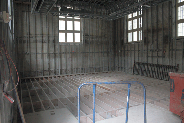 The children’s area of the Police Museum, right, before it closed as a result of Hurricane Sandy damage, and the space as it looks today.  Downtown Express photo by Zach Williams 