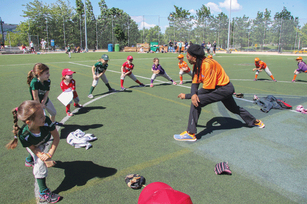 Elizabeth Sanchez and the T-ballers loosen up with some stretching.  Photos by Tequila Minsky