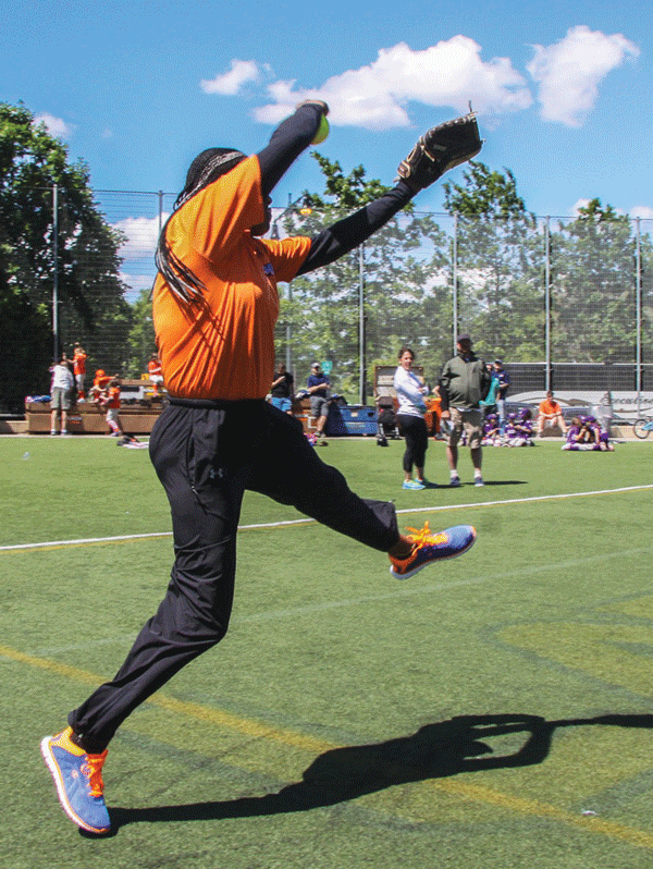 Whip it good! Coach Elizabeth Sanchez in full fierce windmill mode.