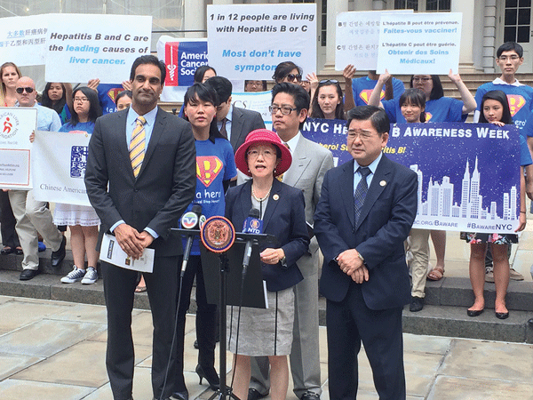 July 21, on the steps of City Hall: Councilwoman Margaret Chin (at the podium) with Dr. Jay Varma, the city health department’s deputy commissioner for disease control, Dr. Vivian Huang (in a prevention T-shirt), the hepatitis B program director at the Charles B. Wang Community Health Center, Dr. Warren Chin, executive director of the Chinese-American Medical Society, and Councilman Peter Koo.