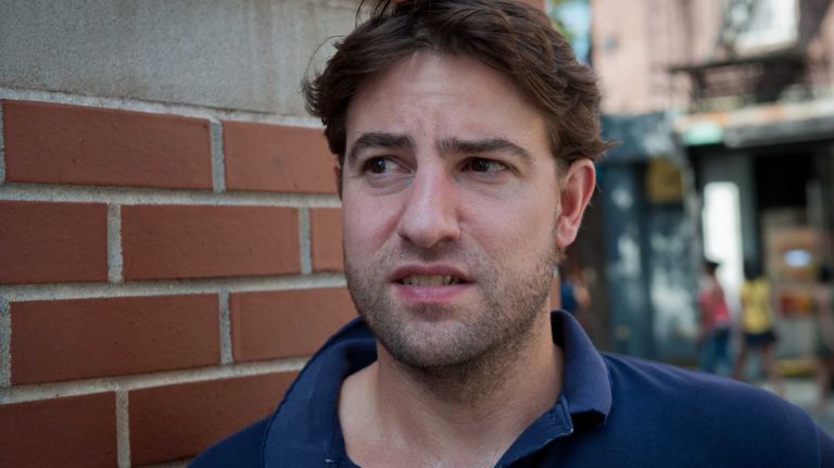 Eli Slyder, 38, of the West Village in Manhattan, discusses his friend, Zubair Khan, outside his home on Monday, July 7, 2014.