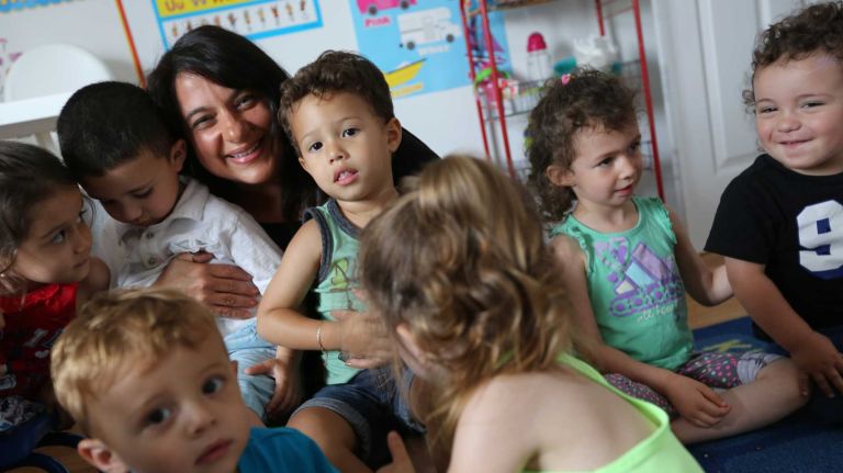Francis O. Scarantino with children from her Reach for the Stars daycare at 156-18 96th street in Howard Beach, Queens, Thursday, June 26, 2014.