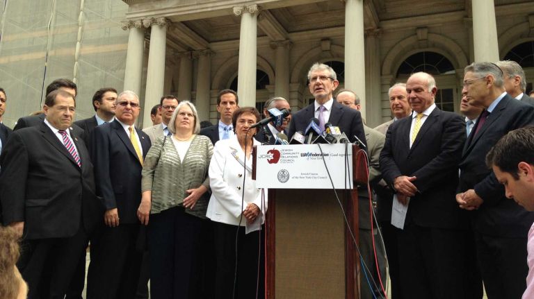Politicians and New York Jewish community leaders, including speaker Michael S. Miller of the JCRC, stage a rally in support of Israel at City Hall.