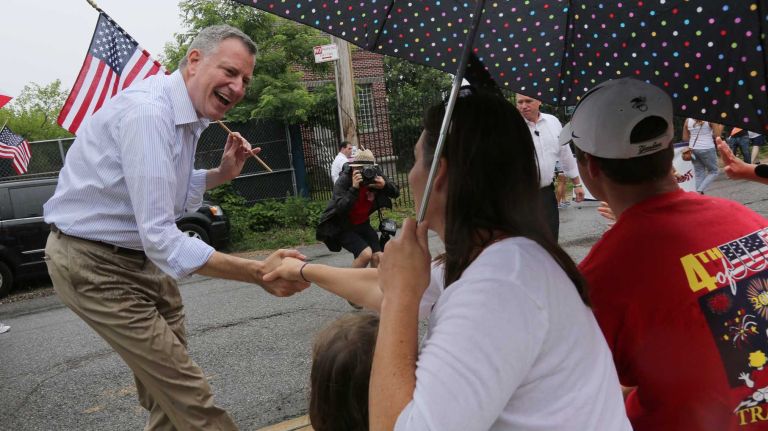 Mayor Bill de Blasio marches in the 104th annual Travis Parade in Staten Island and greets people along the parade route,  Friday, July 4, 2014. The Travis Parade is one of the oldest July Fourth parades in the nation.