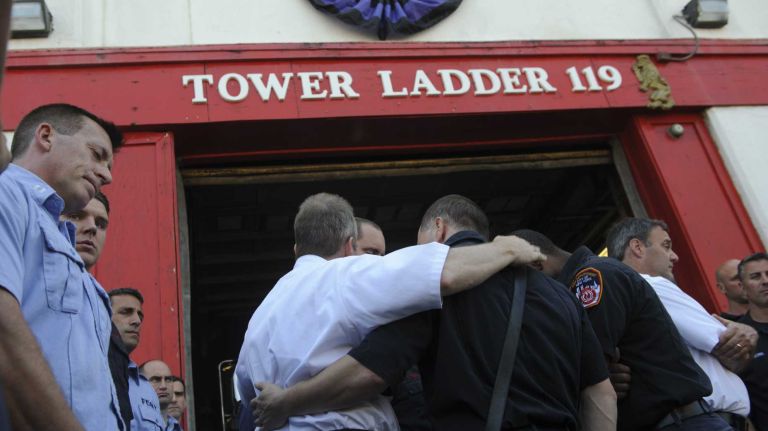 Purple and black bunting is hung on the Bushwick firehouse of FDNY Tower Ladder Company No. 119 and Engine Company No. 211 for Fire Lt. Gordon Ambelas on Sunday, July 6, 2014.