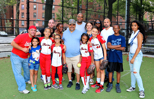Luis Guzman, center, joined the L.E.S. Lady Furies at Jackson Park on the Lower East Side at the team’s last practice of the season.  Photo by Damien Acevedo