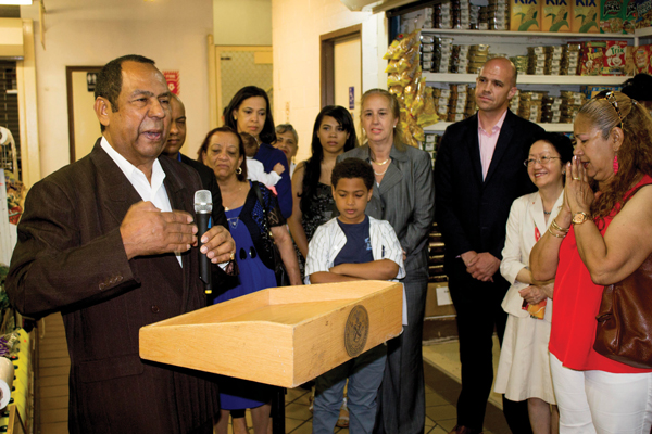 Luis Batista was joined by local officials and family members as he spoke at his retirement ceremony at the Essex Street Market last Friday. Councilmember Margaret Chin is second from right, and Borough President Gale Brewer is fourth from right.  Photos by Zach Williams