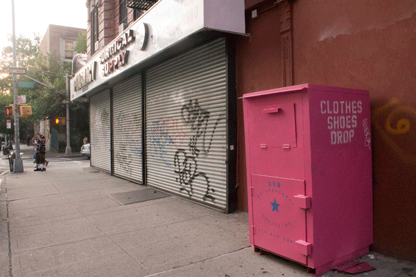One of the dubious pink clothes-donation boxes, at Delancy and Ridge Sts. Photo by Zach Williams