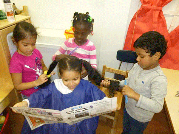 Photo courtesy of P.S. 142 P.S. 142 students doing their “beauty salon” — the sort of interactive learning that will be further enabled by the interactive, touch-screen tables arriving later this summer. The multitasking pupils were also keeping up on their Bridgegate news. 