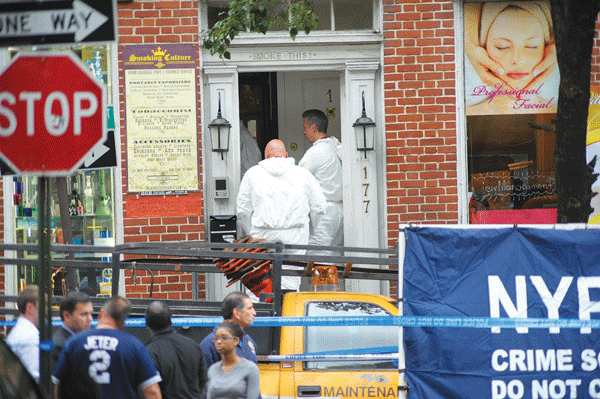 Fugitive felled in gun battle inside smoke shop 2 Crime-scene detectives recovering bullet shells and investigating the premises at the Smoking Culture NYC store, on W. Fourth St., on Monday after the shootout between fugitive Charles Mozdir and three officers. Photo by Jason B. Nicholas
