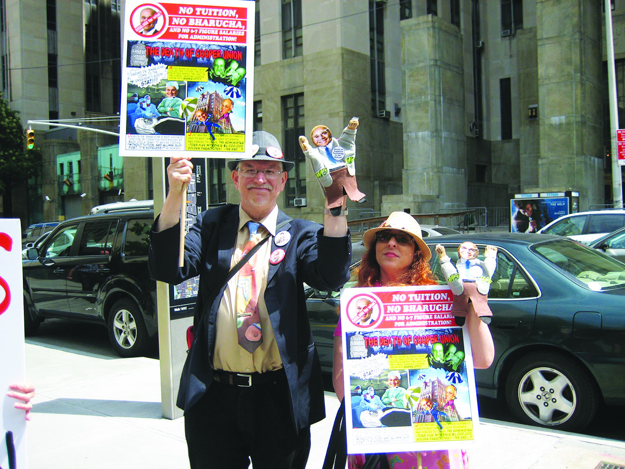 Protesters brandished placards and Jamshed Bharucha puppets — which imply the school president is merely the trustees’ president — outside court last Friday.  Photos by Dusica Sue Malesevic