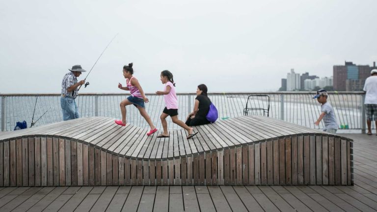 People on the pier in Coney Island Brooklyn, on August 1, 2014. By Anthony Lanzilote.
