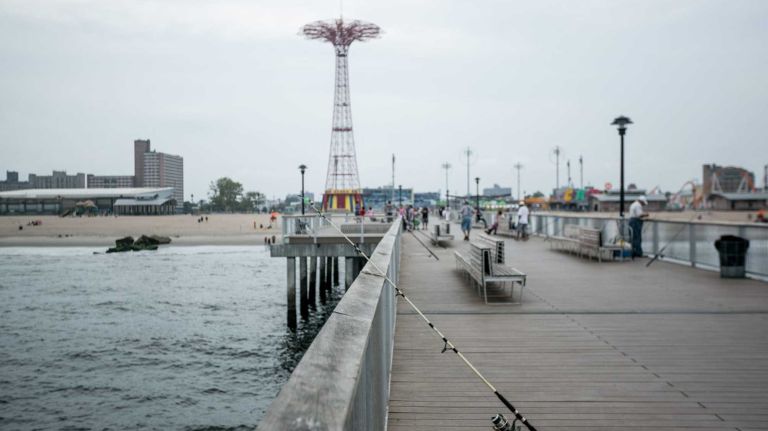 People on the pier in Coney Island Brooklyn, on August 1, 2014. By Anthony Lanzilote.