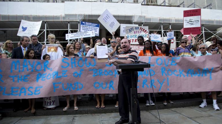 Protesters call for Rockaway Ferry extension 2 Lew Simon, Democratic district leader for the 23rd Assembly District, holds up petition papers while speaking during a news conference at the City Hall held by Rockaway United to Save Our Ferry Aug. 21, 2014.
