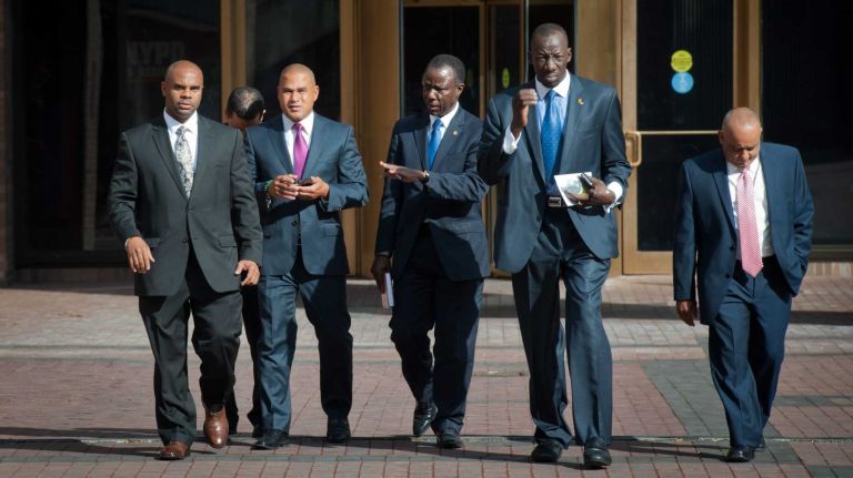 Livery cab activist Fernando Matteo (2nd from Left) leaves One Police Plaza following a meeting with NYC Police Commissioner William Bratton about the recent string of livery cab drivers shootings, on Wednesday, Aug. 13, 2014.